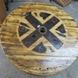 A large mid century converted cable reel