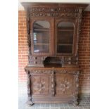 Large German bookcase with carved lion m