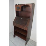 An Arts & Crafts bureau bookcase with a