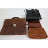 A leather briefcase and three handbags,