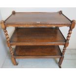 An early-mid 20th century oak three tier