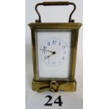 A 19th Century brass carriage clock, with key (maker's name worn on dial, possibly Frodsham),