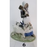 A Royal Copenhagen porcelain figure group, `Girl with Goats', 694, 22cm high (a/f),