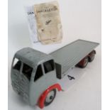 A Shackleton Foden clockwork diecast model Flatbed Lorry, painted grey with red wheel arches,