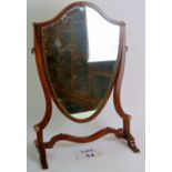 A 19th century mahogany shield shaped swing vanity mirror on ornate base,