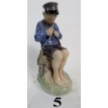 A Royal Copenhagen porcelain figure `The Whitler', 905, 19cm high (a/f),