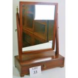 A Georgian mahogany swing vanity mirror, with box base, drawer, and front ogee bracket feet,