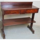 An early Victorian 'flame' mahogany serving table with blind drawer,