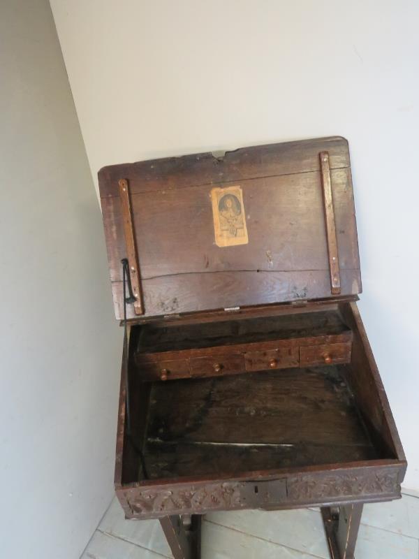 An early 18th century carved oak bible box on later stand, with iron butterfly hinges, - Image 2 of 2