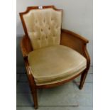 A 20th century bergere armchair with caramel buttoned velvet back & seat,