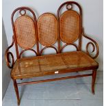 A fine early 20th century bent-wood bergere two seater hall seat,