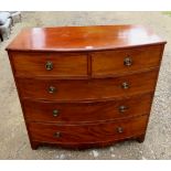 A George III mahogany bowfront chest of 2 short over 3 long drawers with brass ring handles,