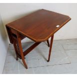 An Edwardian mahogany and satinwood cross banded Sutherland table,