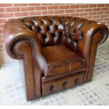 A 20th century brown leather deep buttoned Chesterfield armchair est: £280-£320