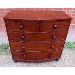 A fine Georgian mahogany bow fronted chest of two short over three long drawers,