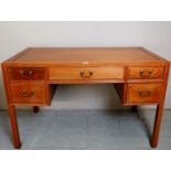 A 20th century Chinese writing desk with central frieze drawer,