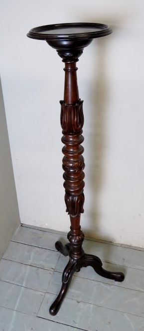 A fine late Victorian carved mahogany jardiniere stand,