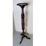 A fine late Victorian carved mahogany jardiniere stand,