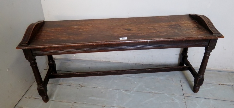 A c1900 oak window seat with reeded frieze decoration,