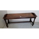 A c1900 oak window seat with reeded frieze decoration,