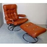 An Ekornes stress less recliner chair and stool upholstered in brown leather,