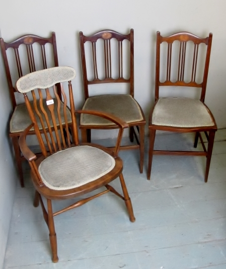 Three Edwardian inlaid chairs and an Edwardian elbow chair, all upholstered the same,