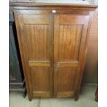 A continental fruit-wood double wardrobe with panelled doors est: £80-£120