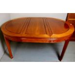 A fine 20th century Chinese extending pull out oval dining table,