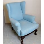 A duck egg blue wing back armchair (very comfortable) and terminating on carved ball & claw feet