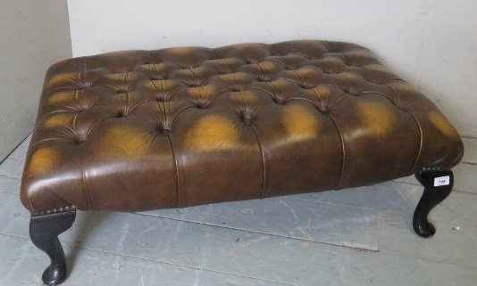 A late 20th century brown/tan leather buttoned foot stool,