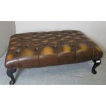 A late 20th century brown/tan leather buttoned foot stool,