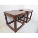 A pair 2nd half 20th century dark teak side tables with inset, possibly leather tops,