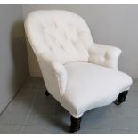 A c1900 cream upholstered armchair,