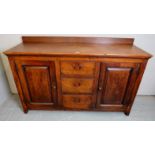 A Georgian oak sideboard with three central drawers,