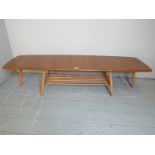 A fine Ercol Windsor extending coffee table,