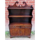 A Georgian style late 20th century mahogany bookcase/cupboard with three shelves above double