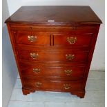 A 20th century mahogany bachelors chest with brushing slide over 4 drawers,