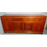 A fine 20th century Chinese sideboard with four drawer, over four cupboards,