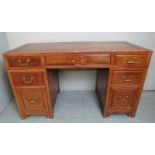 A good quality Chinese pedestal desk with three drawers, brass handles,