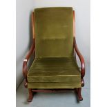 A late Victorian mahogany rocking chair not in a green velour material,