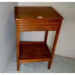 An early 20th century pale oak side table with a blind drawer,