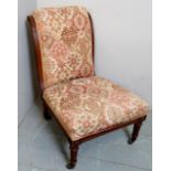 An Edwardian carved nursing chair,