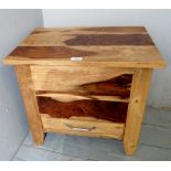 An unusual hardwood cabinet with a lift up lid over a single drawer,