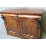 A late Victorian mahogany sideboard with two blind drawers over double arch panelled doors and a