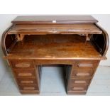 c1900 oak D type roll top writing desk with a fitted interior over drawer est: £50-£100