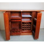 A 20th century Chinese quality drinks cabinet, with fold out top,