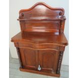 A Victorian pale mahogany chiffonier with raised back over a serpentine drawer and cupboards