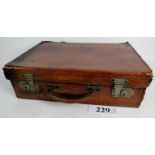 A vintage leather travel case with lined