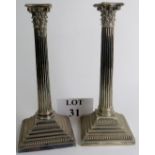 A pair of good quality early 20th century Elkington & Co silver plated candlesticks in the form of