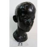 A bronze bust modelled as the head of a youth, initialled 'W.